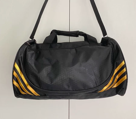 潮酷黑金运动桶包男女通用旅行健身包 九成新...