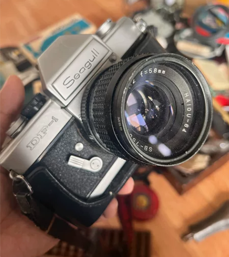 处理一台金属海鸥机械相机，还带原背带的，无...