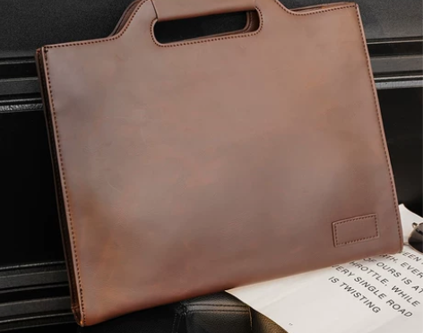 ?2023新款男手提包休闲青年单肩包商务公...