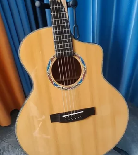 40寸的全单桃花芯吉他，从买到现在不到10...