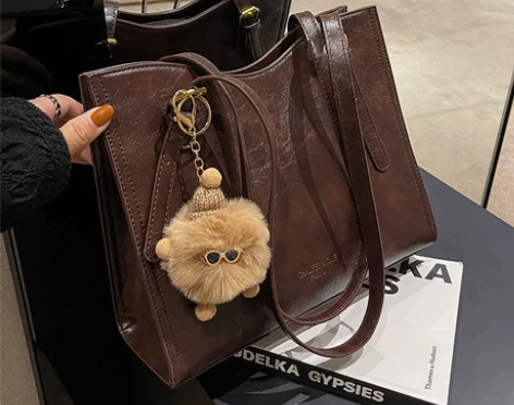 ?春夏复古大容量包包2024新款女包流行通...