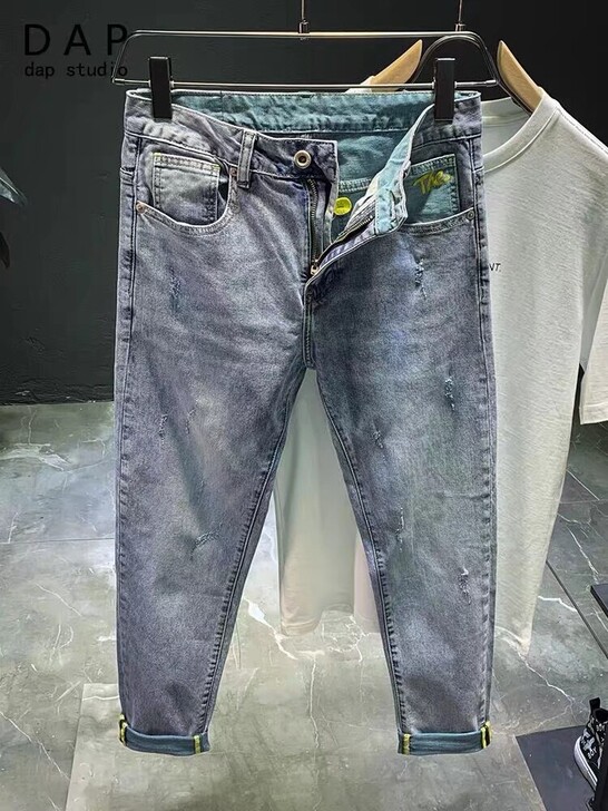 2021春夏薄款浅蓝色牛仔裤男拼色刮烂微哈...