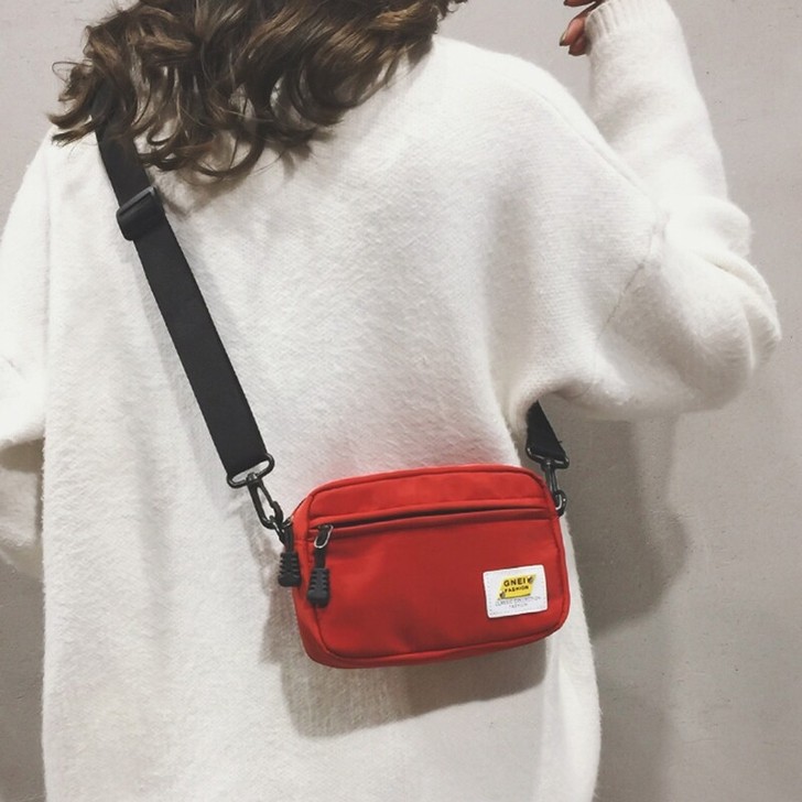 暖心包包秋季新款纯色时尚运动牛津布方形钉牌...