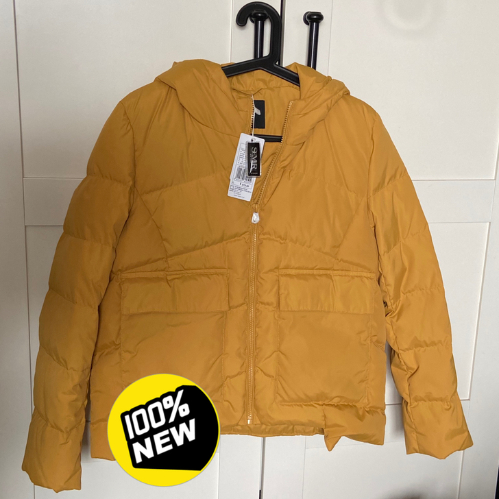 全新羽绒服，拉链上的包装纸都还在~