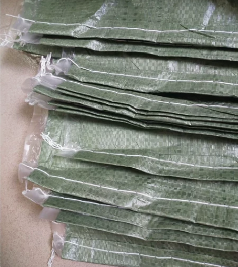 灰绿加厚外覆膜防水编织袋表面压膜防潮蛇皮袋...