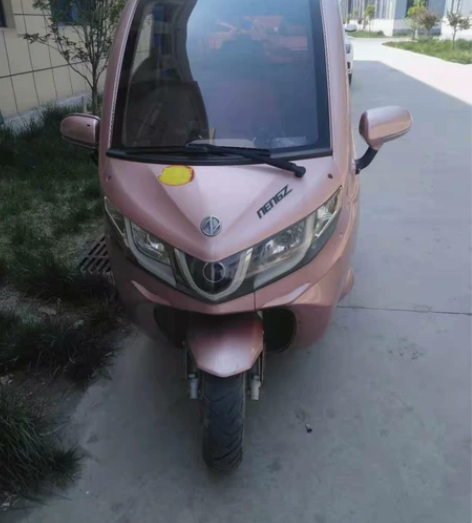 因城市限行低价出售能众封闭式电动车,去年1...