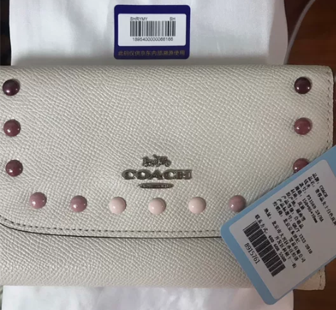 正品Coach/蔻驰女士米白色皮质翻盖三折...