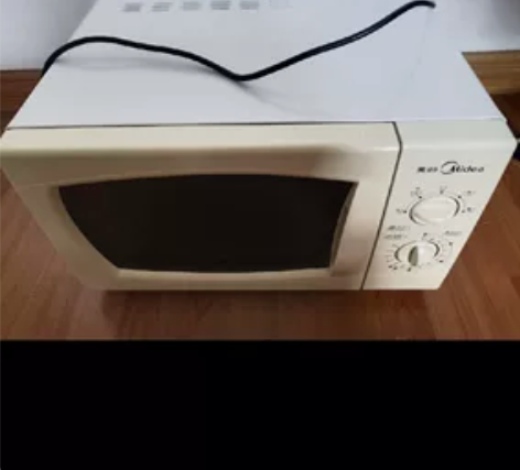 美的微波炉。机械版。操作简便。快速加热。内...