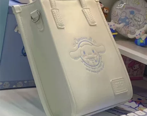 2022新款三丽鸥手提包女可爱库洛米玉桂狗...