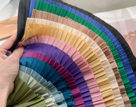 夏日调色盘~高腰垂感不规则过膝百褶裙女遮胯...