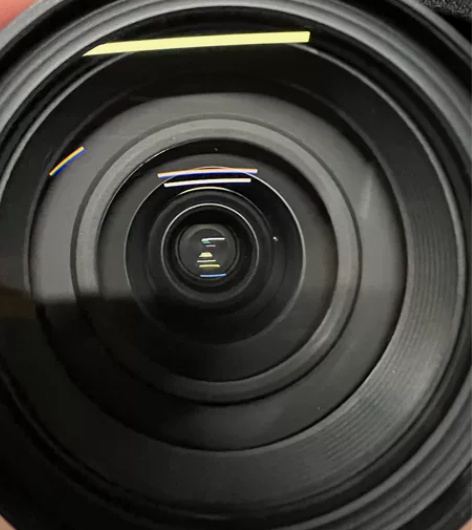 腾龙27-70镜头，镜头前端有一个灰点，不...