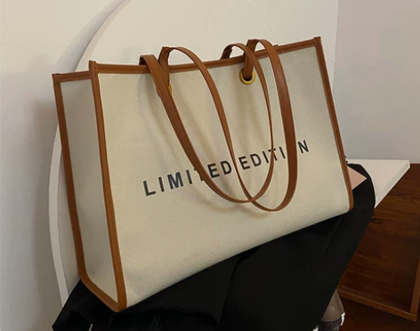 大容量包包女2021新款潮时尚帆布单肩包通...