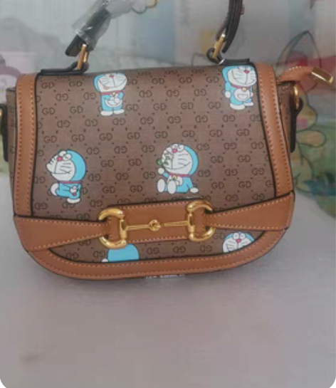 包邮全新机器猫哆来a梦皮包女士小包手拿包单...