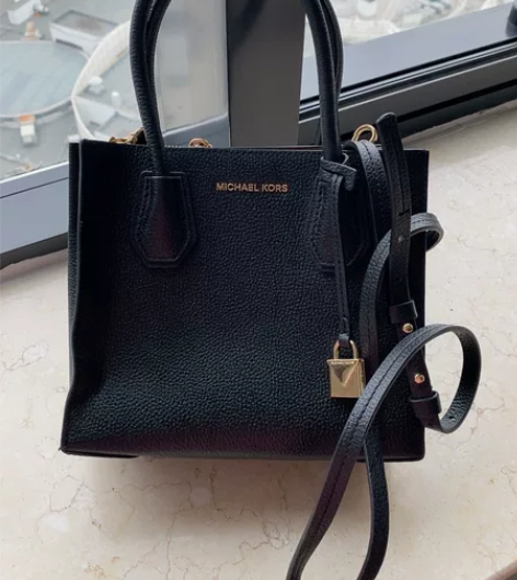 Mk 黑色小号mercer正品 底部钉有点...