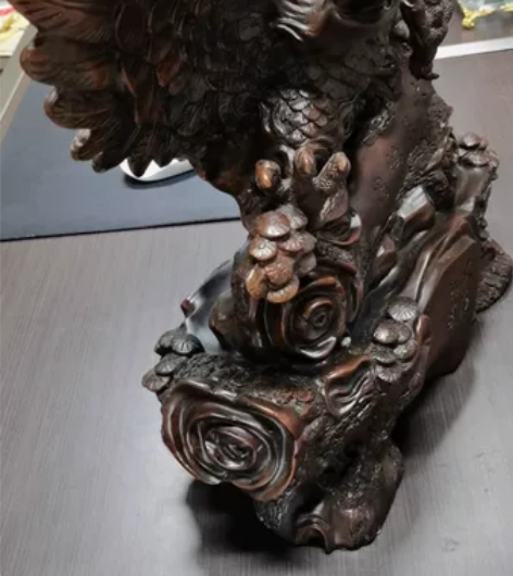 去年公司开业买的老鹰木雕摆件，长45宽9高...