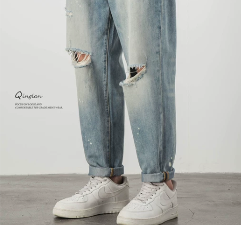 膝盖破洞牛仔裤男潮牌宽松直筒浅色休闲泼漆乞...