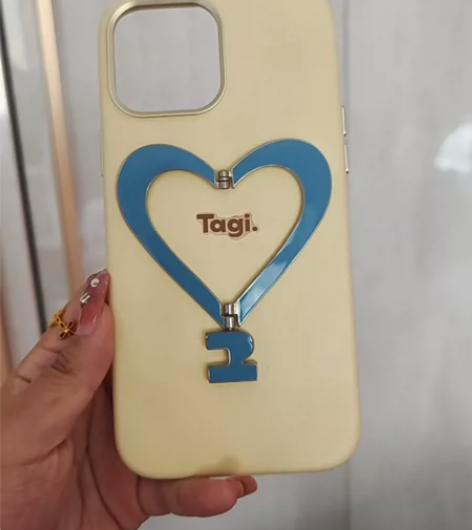 Tagi.《让人开心》金属支架皮质爱心手机...